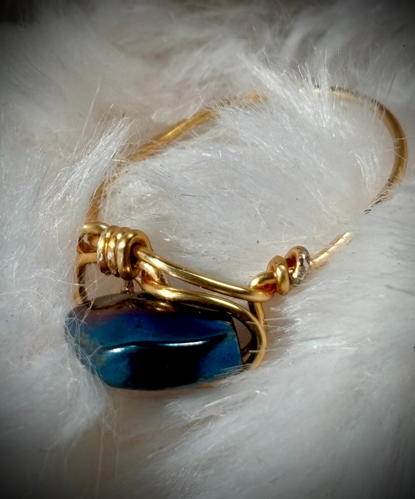 Blue strength: Aurora coated hematite in blue ring