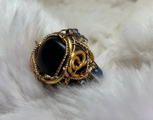 Mahogany obsidian ring : grounded fire