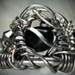 Black Onyx and Argentinian, silver ring: ￼ commanding strength