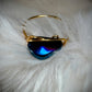 Blue strength: Aurora coated hematite in blue ring