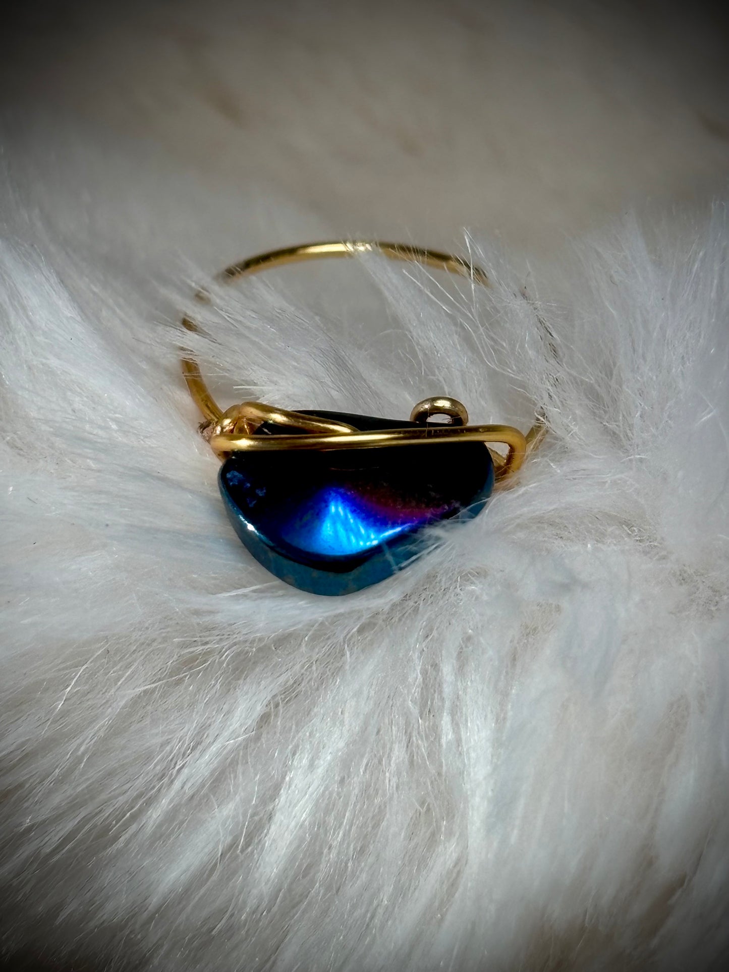 Blue strength: Aurora coated hematite in blue ring