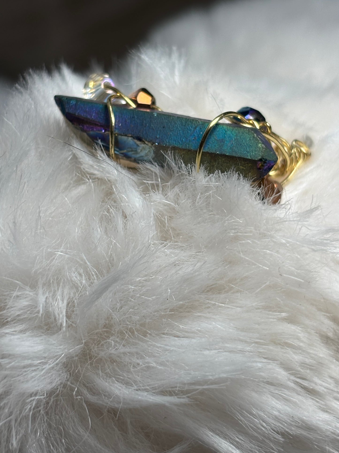 Celestial blade: Titanium Aura Quartz “ rainbow quartz”